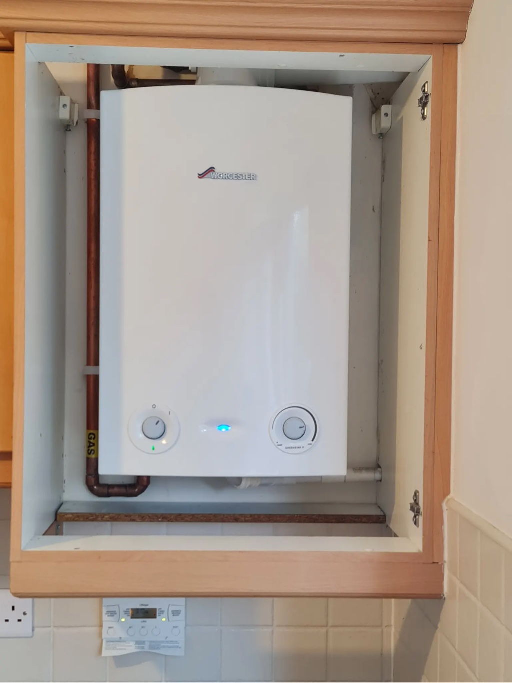New Worcester boiler installed in wall-mounted cupboard